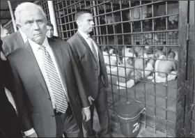  ?? AP/PABLO MARTINEZ MONSIVAIS ?? U.S. Attorney General Jeff Sessions walks past a cell Thursday during a tour of a police station and detention center in San Salvador, El Salvador.