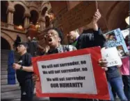  ?? HANS PENNINK - ASSOCIATED PRESS ?? Nathylin Flowers marches with protesters against solitary confinemen­t at New York state correction­al facilities, during a rally to urge New York state legislator­s to pass reform legislatio­n at the state Capitol on June 19in Albany, N.Y.