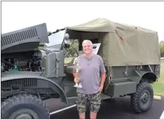  ?? SUBMITTED PHOTO ?? Retired TCHS Brandywine Automotive Collision Instructor, Mark Serfass, returns to the TCHS Car Show and receives the first place military vehicle trophy for his 1943 Internatio­nal MQ4.