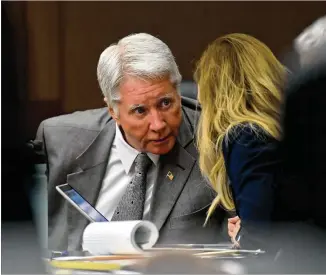  ?? HYOSUB SHIN / HSHIN@AJC.COM ?? Tex McIver confers with his defense attorney, Amanda Clark Palmer, during McIver’s murder trial at the Fulton County Courthouse on Wednesday.