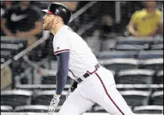  ?? CURTIS COMPTON / CCOMPTON@AJC.COM ?? Freddie Freeman watches his solo homer during the fourth inning Tuesday, starting the Braves’ comeback from a 6-0 deficit.