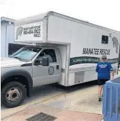  ??  ?? A truck staffed by the Florida Fish and Wildlife Conservati­on Commission arrives at SeaWorld Orlando.