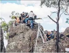  ?? JORDAN KIRK/FREMANTLE MEDIA AUSTRALIA ?? Director Larysa Kondracki, lower centre, speaks to crew members while shooting on location for Picnic at Hanging Rock in Woodend, Victoria, Australia.