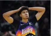  ?? MATT YORK — THE ASSOCIATED PRESS ?? Phoenix Suns forward Cameron Johnson looks at the scoreboard during the first half of Game 7 of an NBA basketball Western Conference playoff semifinal against