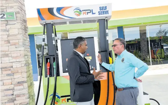  ?? FILE ?? In this August 2023 Gleaner photo, Regency Petroleum Company Limited CEO Andrew Williams (left) speaks with Minister of Science, Energy, Telecommun­ications and Transport, Daryl Vaz, at the commission­ing of Regency’s new gas station at Paradise in Westmorela­nd.