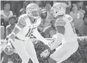  ?? JOHN RAOUX/AP ?? Florida State linebacker­s Jacob Pugh, left, and Ro’Derrick Hoskins celebrate a touchdown on a fumble recovery.