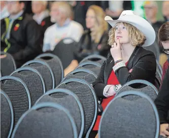  ?? JEFF MCINTOSH THE CANADIAN PRESS ?? Calgary 2026 Olympic bid supporters listen to speeches during a rally in Calgary on Nov. 5. Tuesday’s plebiscite is non-binding, but the result could give direction to city council on whether to pursue the Games.