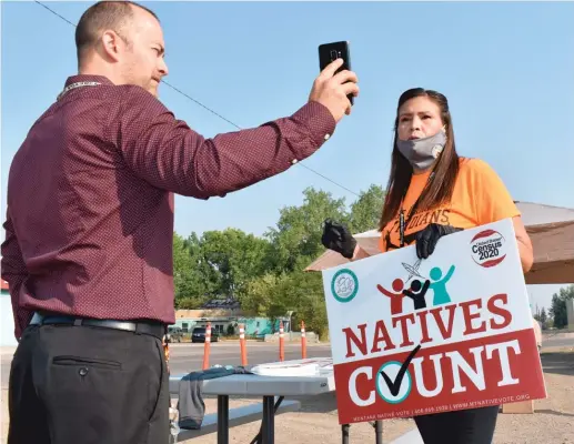  ??  ?? Activist Lauri Dawn Kindness ( right) speaks at the Crow Indian Reservatio­n, in Lodge Grass, Montana. Native Americans make up less than 2% of the U. S. population and often are listed in datasets as “other” or denoted with an asterisk.