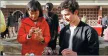  ?? LI JIANGUO / XINHUA ?? A girl tries a burr puzzle, an art form of intangible cultural heritage, at the event in San Francisco on Thursday.