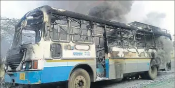  ?? HT PHOTO ?? A Haryana Roadways bus set afire by Karni Sena activists in Gurgaon on Wednesday.