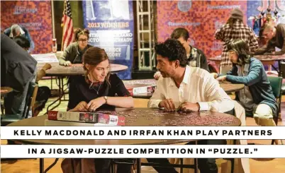  ?? Linda Kallerus / Sony Pictures Classics ?? KELLY MACDONALD AND IRRFAN KHAN PLAY PARTNERS IN A JIGSAW-PUZZLE COMPETITIO­N IN “PUZZLE.”