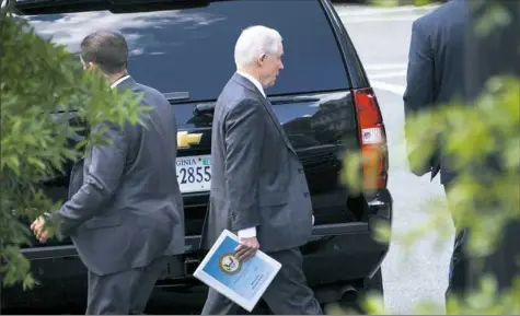  ?? Doug Mills/The New York Times ?? Attorney General Jeff Sessions departs the White House on Wednesday morning in Washington. President Donald Trump publicly attacked Mr. Sessions for a third straight day Wednesday, questionin­g why Mr. Sessions had not fired the acting FBI director over...