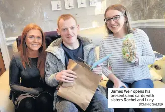  ?? DOMINIC SALTER ?? James Weir opens his presents and cards with sisters Rachel and Lucy