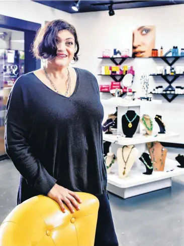  ?? [PHOTOS BY CHRIS LANDSBERGE­R, THE OKLAHOMAN] ?? Lilly Stone, owner of Sooo Lilly Cosmetics, poses in her new store in Shoppes at Northpark.