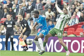  ?? ?? Posh star Kwame Poku battles with Wycombe’s Kieran Sadlier.