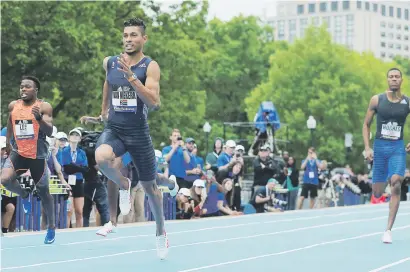  ?? Picture: Reuters ?? FLYING. Wayde van Niekerk leads the field to win the men’s 200 meters at the Boston Games Street Meet in Boston, Massachuse­tts on Sunday.