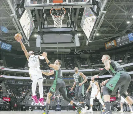  ?? (photo: AFP) ?? Donovan Mitchell of the Utah Jazz drives to the basket during the game against the Boston Celtics on Tuesday at vivint.smarthome Arena in Salt Lake City, Utah.