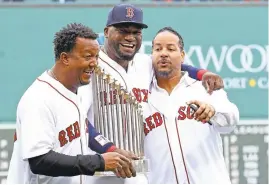  ?? MADDIE MEYER/GETTY IMAGES ?? David Ortiz, center, laughs with Manny Ramirez, right, and Pedro Martinez, left, on Sunday.