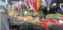  ?? John Raby / Associated Press ?? Crafts are displayed at the Capitol Market in Charleston, W.Va. Its operator didn’t get her 350 trees — supplies were short.