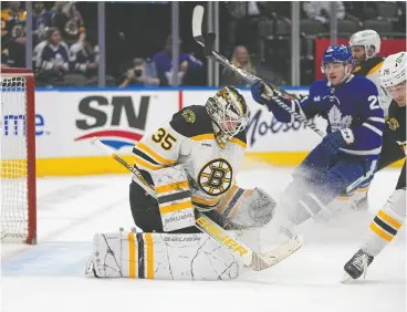  ?? JOHN E. SOKOLOWSKI / USA TODAY SPORTS ?? Bruins goaltender Linus Ullmark makes a save against the Maple Leafs during the third
period at Scotiabank Arena in Toronto on Wednesday. Boston rolled to a 5-2 victory.