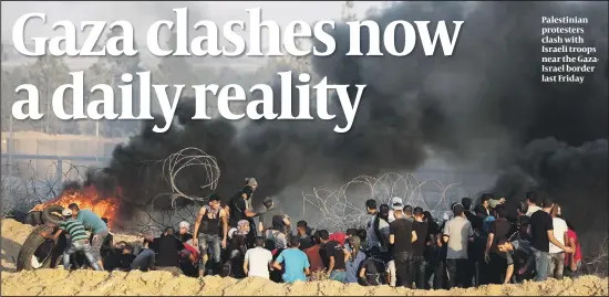  ?? PHOTO: FLASH 90 ?? Palestinia­n protesters clash with Israeli troops near the GazaIsrael border last Friday