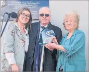  ?? ?? Rose Condon of Nugent’s Pub (right) accepting a plaque during the commemorat­ion weekend from Mattie McGrath TD and Cllr Máirín McGrath.