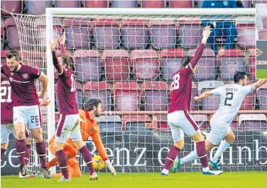  ??  ?? Raith Rovers’ Regan Tumilty scores his side’s third goal against Hearts at Tynecastle