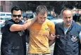  ??  ?? Turkish police escort Renat Bakiev