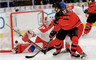  ?? ADAM IHSE/AFP VIA GETTY IMAGES ?? One of three Hockey East goalies to appear in the recent World Junior Hockey Championsh­ips, UMass’s
Michael Hrabal backstoppe­d Czechia to a quarterfin­al victory over Canada.