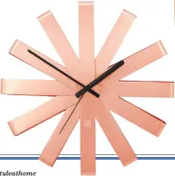  ??  ?? £40 Go for the modern ribbon umbra wall clock in copper for a designer feel, amara