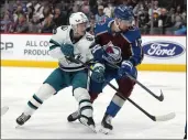  ?? DAVID ZALUBOWSKI — THE ASSOCIATED PRESS ?? Sharks left wing William Eklund, left, jostles for position in front of the net with Colorado Avalanche right wing Valeri Nichushkin in the first period Tuesday in Denver.