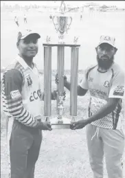  ??  ?? Enmore skipper, Bheemraj Ramkelawan (left) and Lusignan SC captain, Shazam Ali pose with the first place trophy