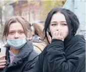  ?? ANASTASIA YAKOVLEVA/AP ?? Students at Perm State University look on after a law student opened fire on Monday morning. At least six people were killed.