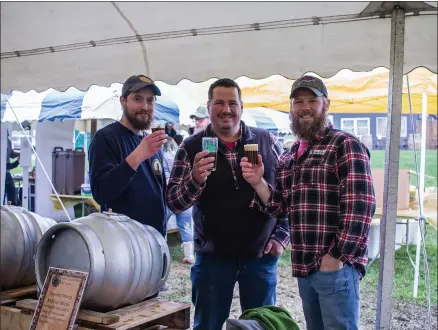  ?? SUBMITTED PHOTO ?? Three gentlemen sling their pints at a previous cask ale festival