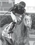  ?? MARTA LAVANDIER/AP ?? Joel Rosario celebrates after Knicks Go won the Pegasus World Cup Invitation­al on Jan. 23.