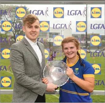  ??  ?? Player of the match Marie Kealy of Wicklow is presented with her award by Lidl representa­tive Jay Wilson.