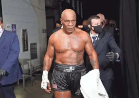 ?? JOE SCARNICI/HANDOUT PHOTO VIA USA TODAY SPORTS ?? Mike Tyson exits the ring after an exhibition draw against Roy Jones Jr. on Nov. 28 in Los Angeles.