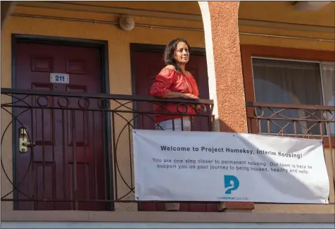  ?? (Damian Dovarganes/AP) ?? Veronica Perez stands outside at her new home at the Mollie Mason Project Homekey site in Los Angeles.