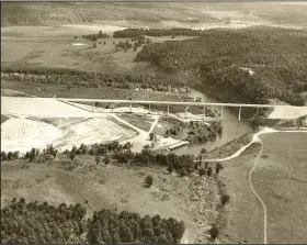  ?? Photo courtesy Rogers Historical Museum ?? Arkansas 12 bridge in 1963 before the lake was filled. The old Arkansas 12 bridge across the White River was built in 1904 and served until it was demolished in August 1963, after the new bridge was opened. The older bridge was located just below the...