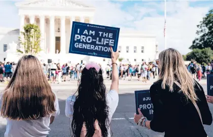  ?? ANNA MONEYMAKER/THE NEW YORK TIMES ?? Protesters with Students for Life of America, an anti-abortion group, stand across the street from a rally opposing Judge Amy Coney Barrett’s confirmati­on in September outside the U.S. Supreme Court in Washington.