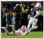  ?? DAVID JABLONSKI / STAFF ?? Ohio State’s Cameron Johnston tries to tackle Penn State’s Grant Haley on his return of a blocked field goal last season in State College, Pa.