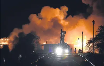  ?? Photograph by Colin Rennie ?? SKY OF SMOKE: Crews take on the fire at the abandoned Cordyce School in Dyce.