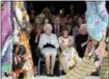  ?? YUI MOK/POOL PHOTO VIA AP ?? Britain’s Queen Elizabeth, second left, sits next to fashion editor Anna Wintour, third left, and Caroline Rush, chief executive of the British Fashion Council (BFC), left, as they view Richard Quinn’s runway show before presenting him with the...