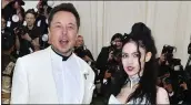  ?? ANGELA WEISS — AFP VIA GETTY IMAGES ?? Elon Musk and Grimes arrive at the Met Gala in 2018. The Tesla CEO shared photos of their son on Twitter Monday.