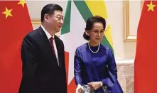  ?? THET AUNG/AFP ?? DUKUNGAN: Xi Jinping (kiri) dan Penasihat Negara Myanmar Aung San Suu Kyi dalam upacara penyambuta­n kenegaraan di Istana Presiden, Naypyidaw, kemarin.