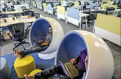  ?? Bloomberg News/DHIRAJ SINGH ?? Employees work at the Flipkart Online Services headquarte­rs in Bengaluru, India, in this file photo. Flipkart is the the No. 1 ecommerce operator in India.