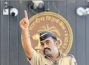  ?? AP ?? A policeman stands guard at the Reserve Bank of India (RBI) headquarte­rs in Mumbai on Wednesday. The RBI has sounded a warning on moderating growth rate and a spike in inflation