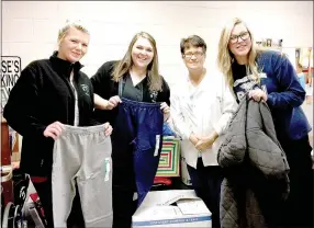  ?? PHOTO SUBMITTED ?? Nursing students Sarina Hunt (left) and Maegan Mooberry, McDonald County High School nurse Tracy Allman and nursing student Brittney Jackson show donated items.