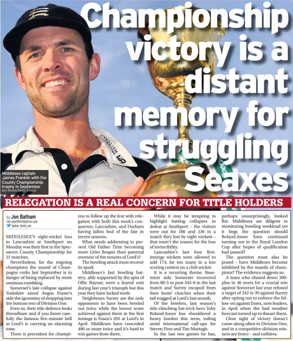  ?? Dan Mullan/Getty Images ?? Middlesex captain James Franklin with the County Championsh­ip trophy in September