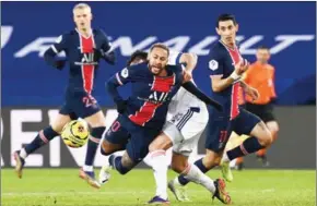  ?? AFP ?? PSG forward Neymar (centre) suffered a bad injury to his ankle in a French Ligue 1 match on December 13, 2020 (unrelated to pic) and had to be stretchere­d off.